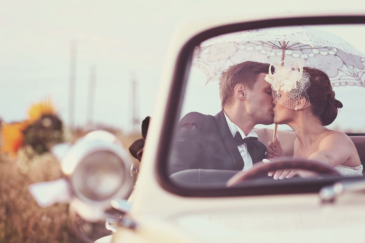 bride and groom with wedding parasol