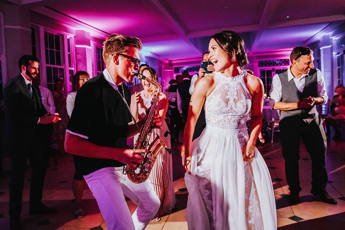 wedding saxophonist with bride
