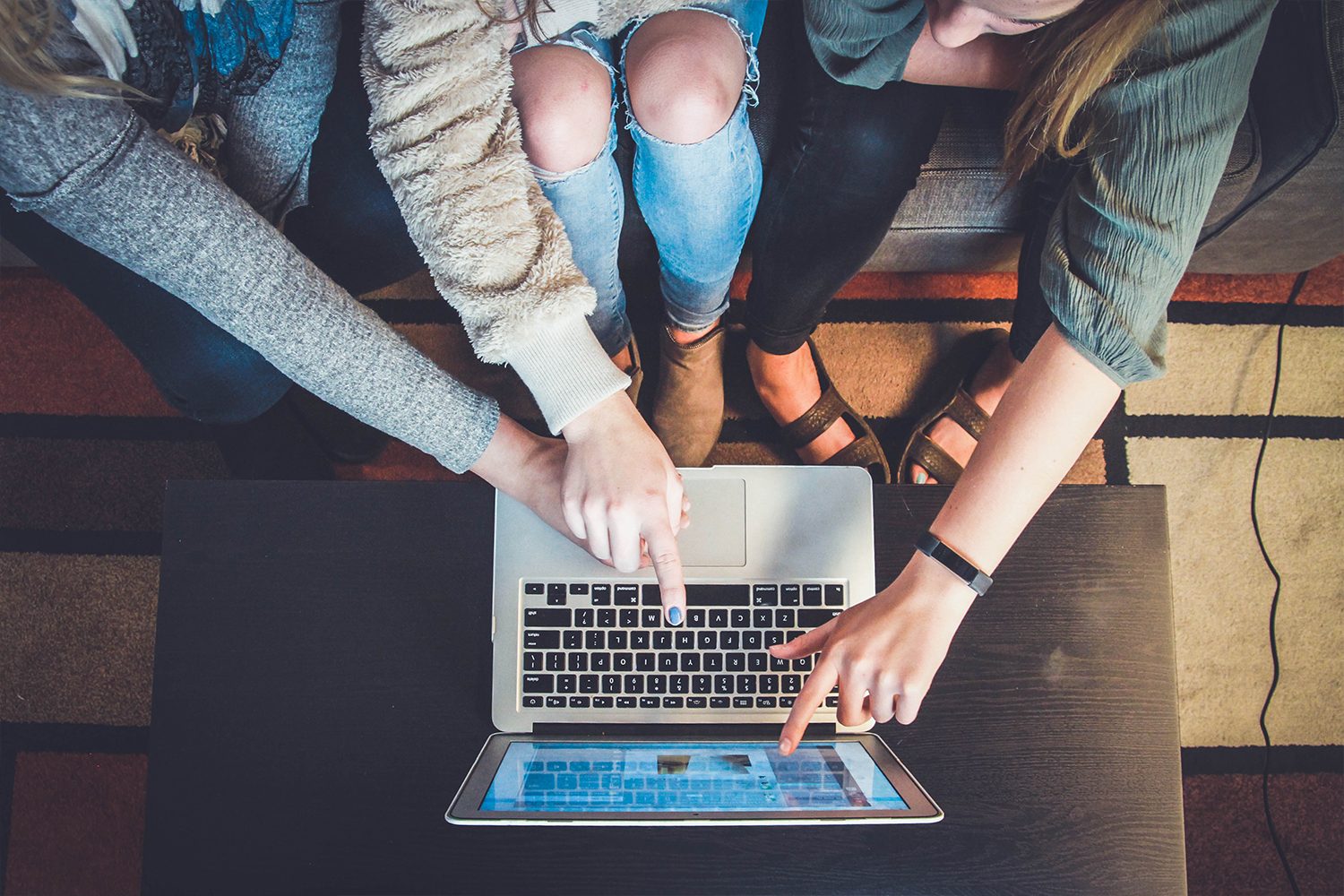 girls looking at a laptop